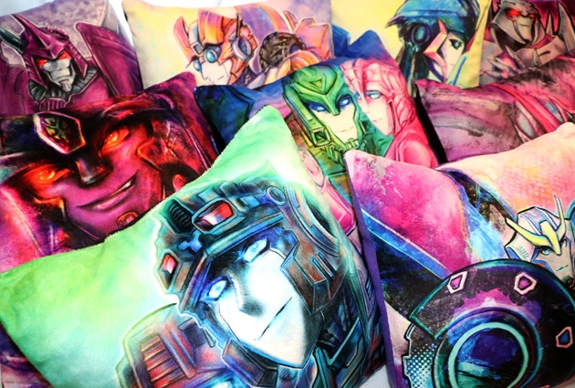 various handmade illustrated Transformers pillows from TFcon